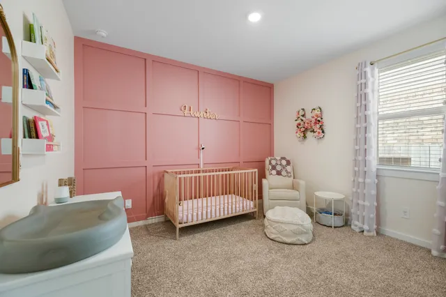 a bedroom with furniture and a bathtub
