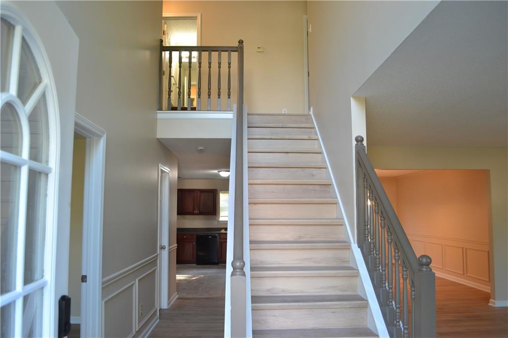 6157 Red Top Loop Union City, GA 30291 - Photo 2 of 26 a view of staircase with white walls and windows