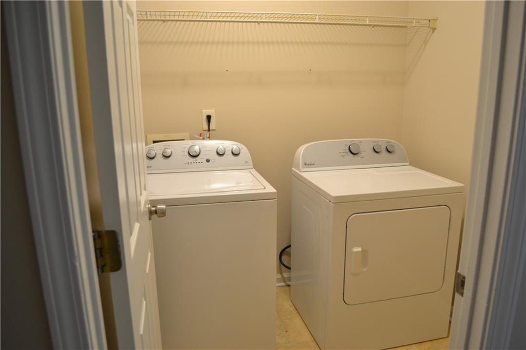 6157 Red Top Loop Union City, GA 30291 - Photo 22 of 26 a utility room with dryer and washer