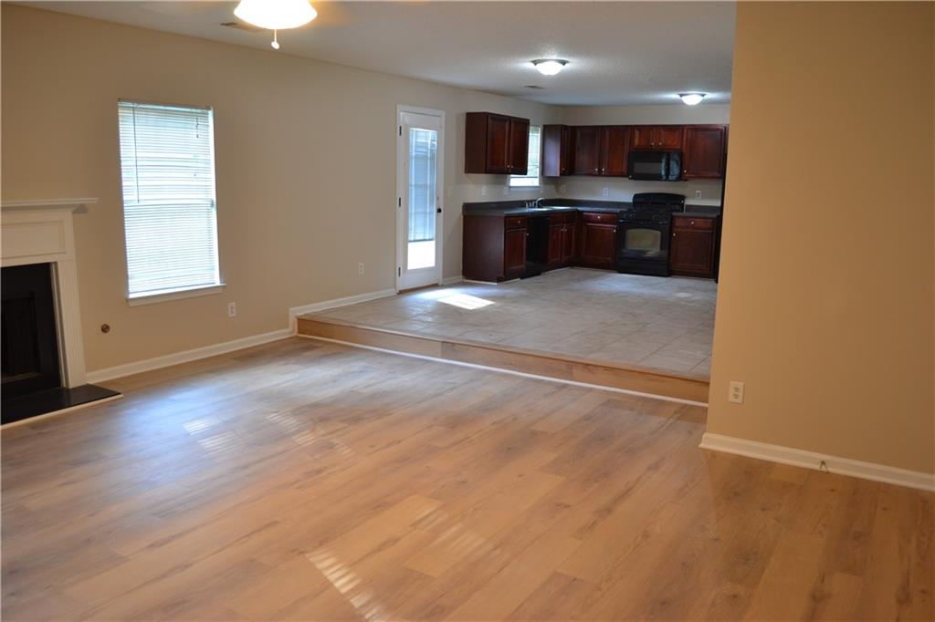 6157 Red Top Loop Union City, GA 30291 - Photo 10 of 26 a view of kitchen with refrigerator stove and microwave