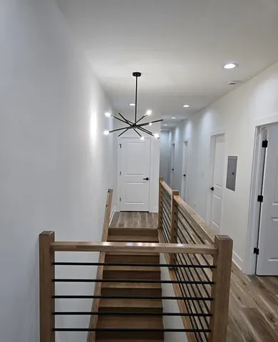 a very nice looking dining room with hardwood floor and a ceiling fan