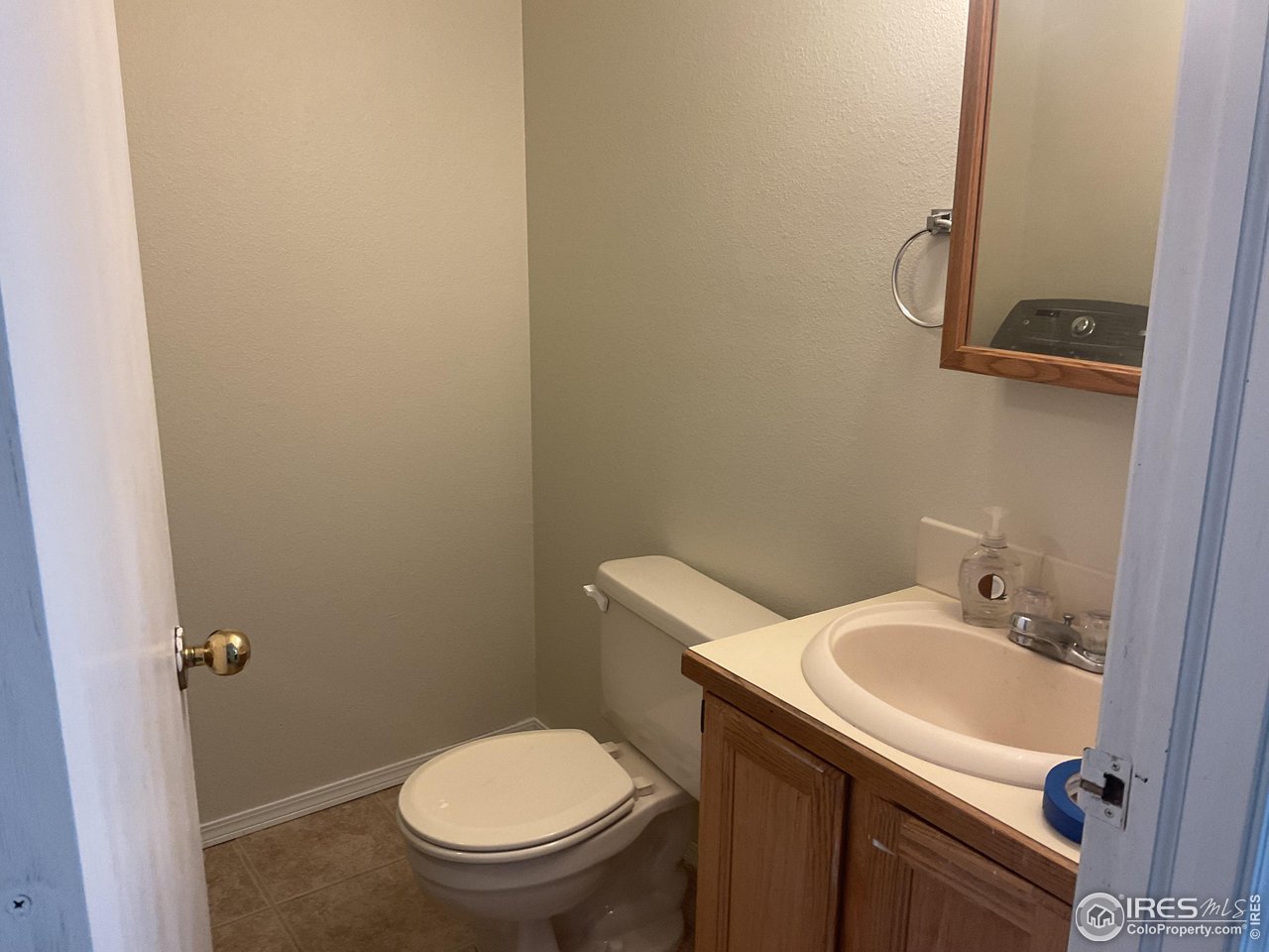 402 Gayle Street Fort Morgan, CO 80701 - Photo 13 of 40 a bathroom with a sink and toilet