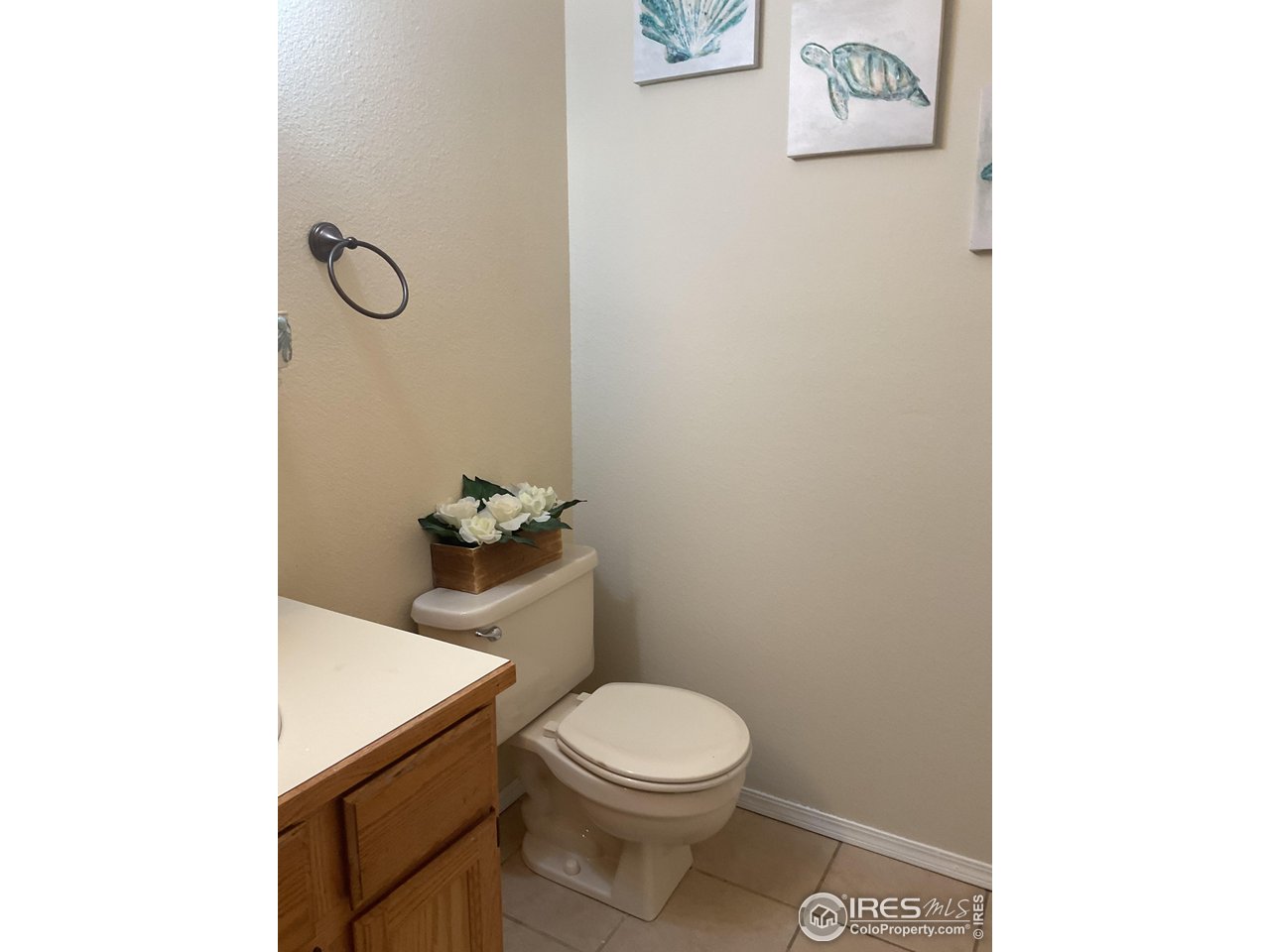 402 Gayle Street Fort Morgan, CO 80701 - Photo 26 of 40 a white toilet sitting next to a white sink