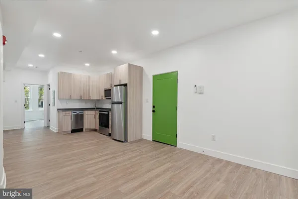 a view of kitchen with wooden floor