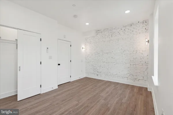 a view of bathroom with wooden floor