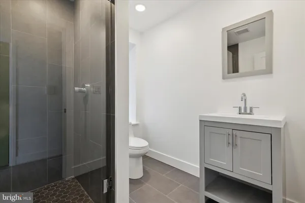 a bathroom with a sink toilet and vanity