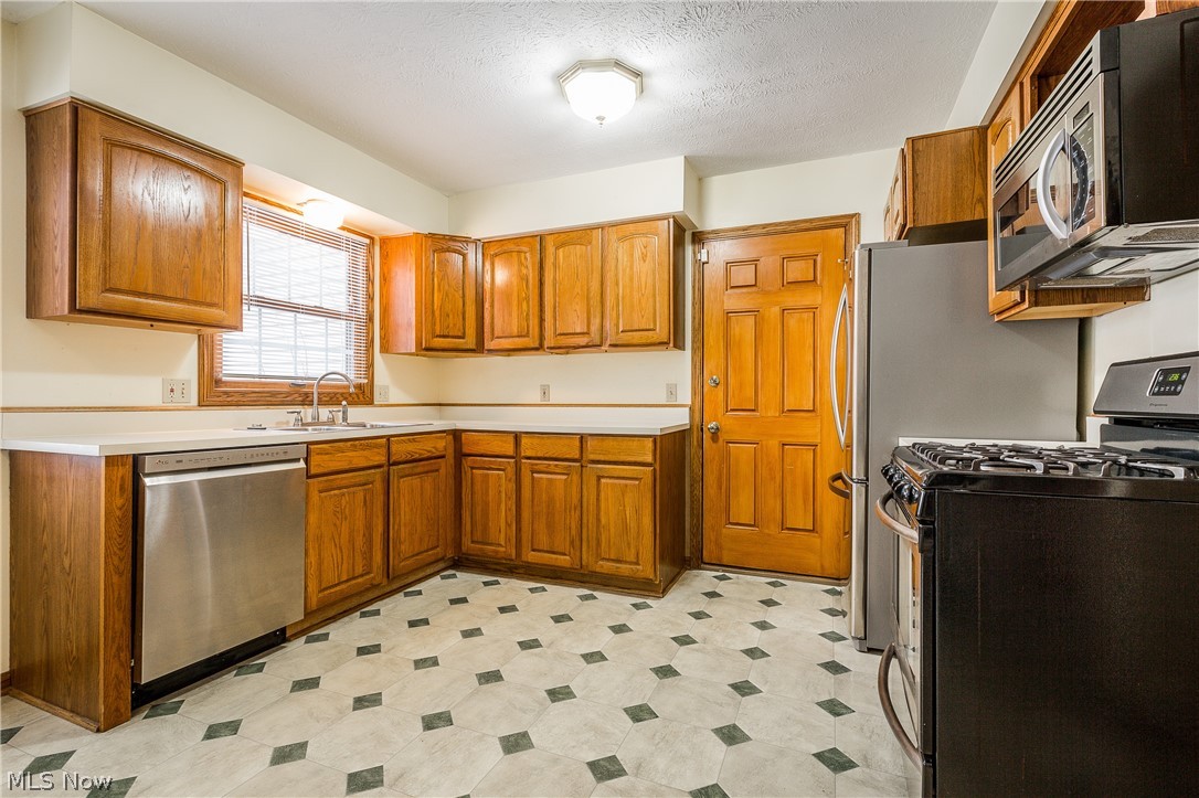 5045 Johnnycake Ridge Northeast Canton, OH 44705 - Photo 23 of 35 Stainless Steel Appliances and lots of cabinets