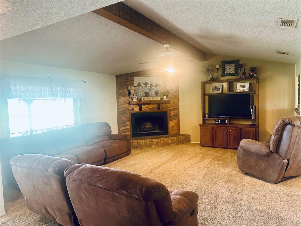 4142 Highway 83 Tuscola, TX 79562 - Photo 12 of 28 a living room with furniture and a flat screen tv