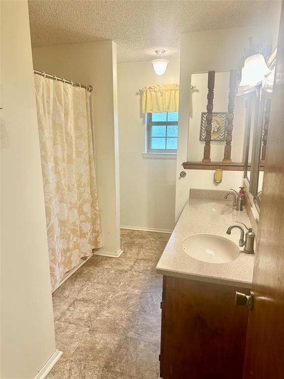 4142 Highway 83 Tuscola, TX 79562 - Photo 9 of 28 a bathroom with a sink and a mirror