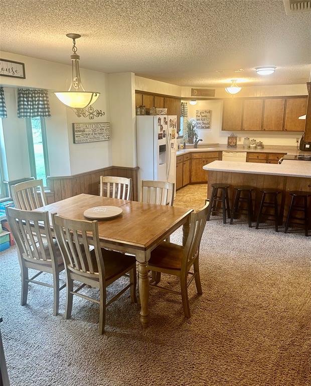 4142 Highway 83 Tuscola, TX 79562 - Photo 10 of 28 a dining room with a wooden table and chairs