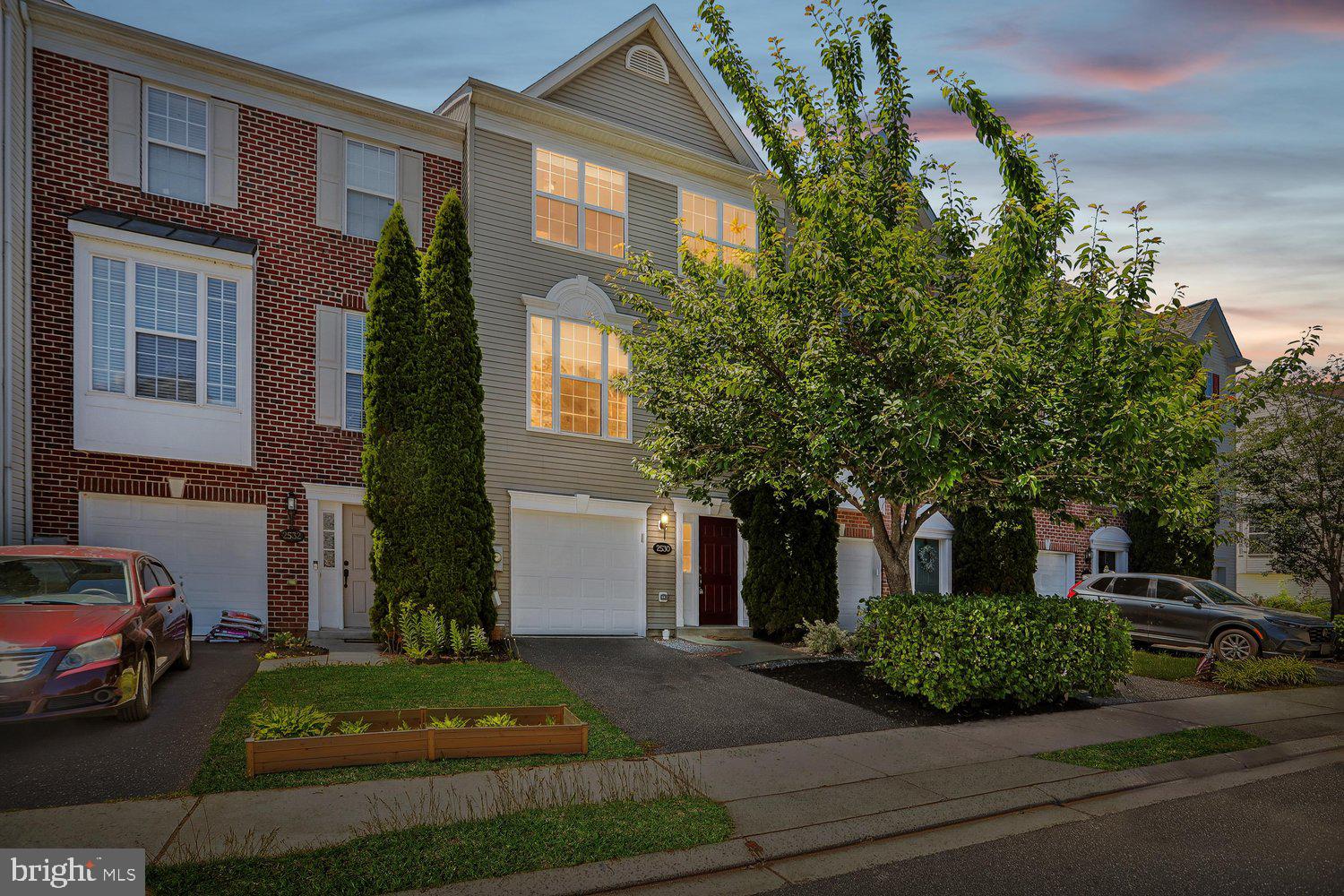 2530 Carrington Way Frederick, MD 21702 - Photo 2 of 38 a front view of a house with a garden