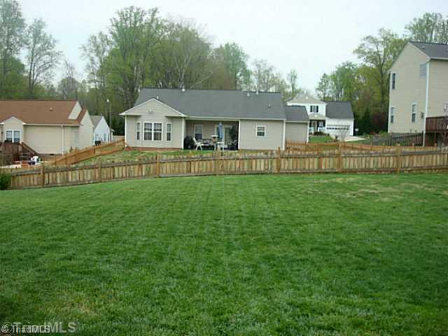 413 Barnsdale Ridge Road Kernersville, NC 27284 - Photo 11 of 15 Exterior Back. Another view of the fenced in back yard.