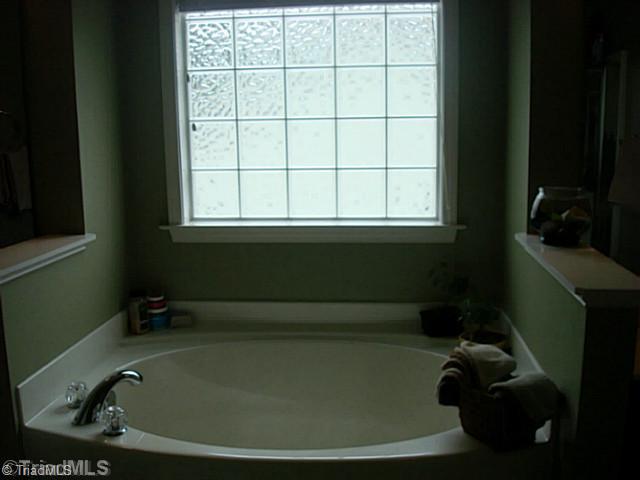 413 Barnsdale Ridge Road Kernersville, NC 27284 - Photo 12 of 15 Master Bath/Spa. Garden Tub with Separate Shower and separate vanities.