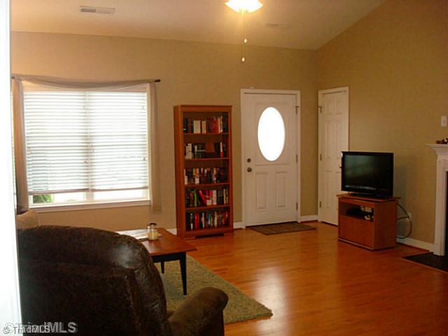 413 Barnsdale Ridge Road Kernersville, NC 27284 - Photo 8 of 15 Living Room. Spacious Living Room with cathedral ceilings, coat closet, ceiling fan and a gas log fireplace.