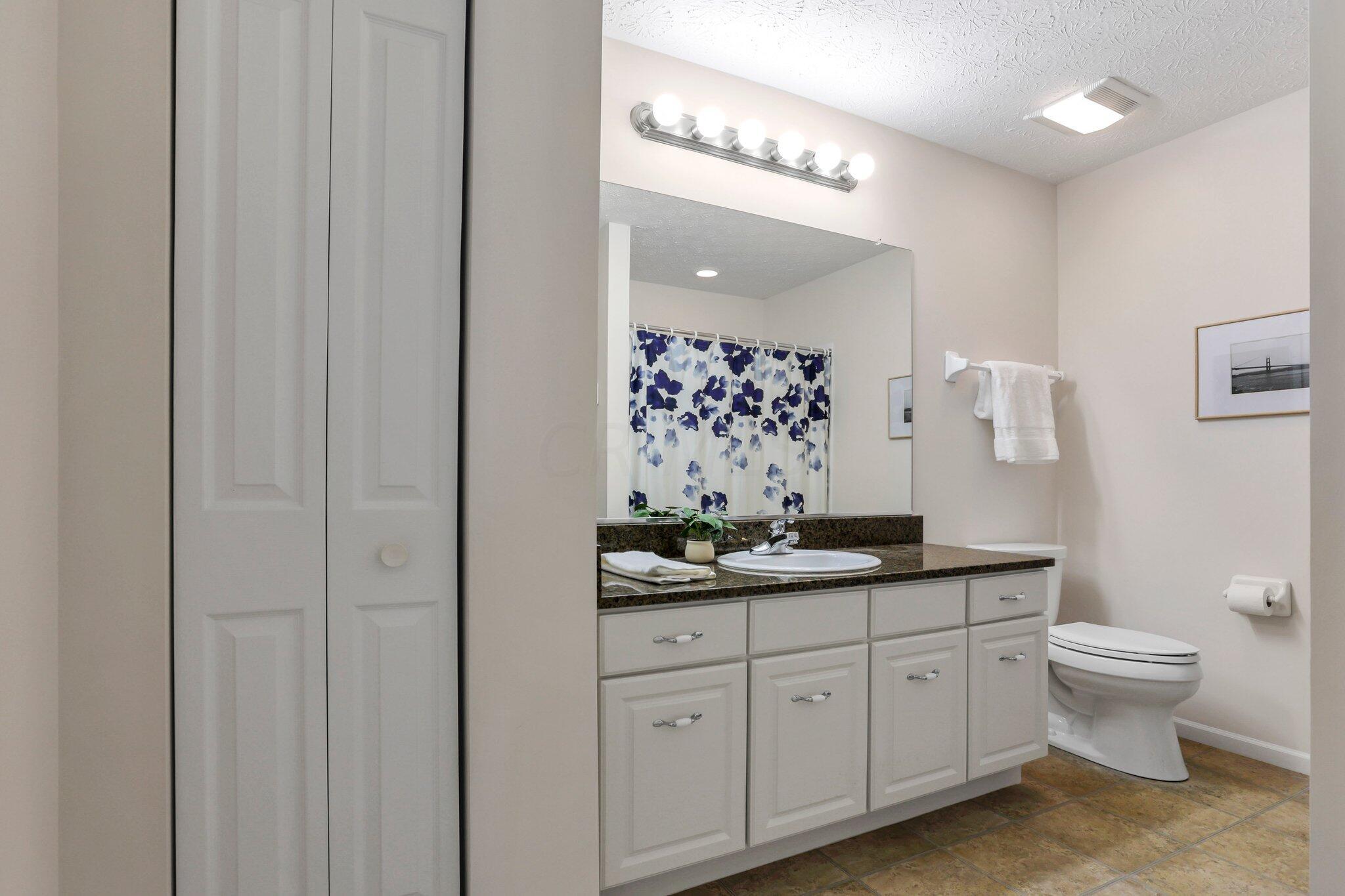4223 Cobbler Road, Unit 16422 New Albany, OH 43054 - Photo 20 of 36 2nd full bathroom with shower/tub combo, granite counters, and linen closet.