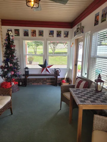 a room with furniture and a large window