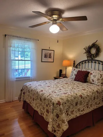 a bedroom with a bed and window
