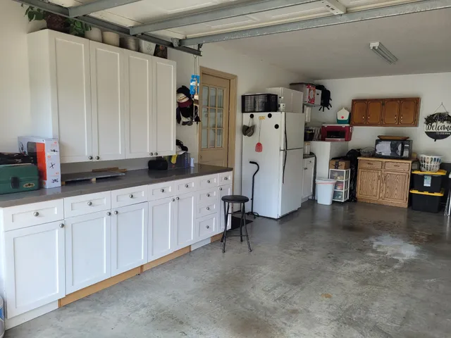 a front view of a house with a yard and a garage