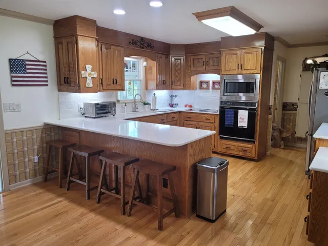 a large kitchen with lots of counter space and a sink
