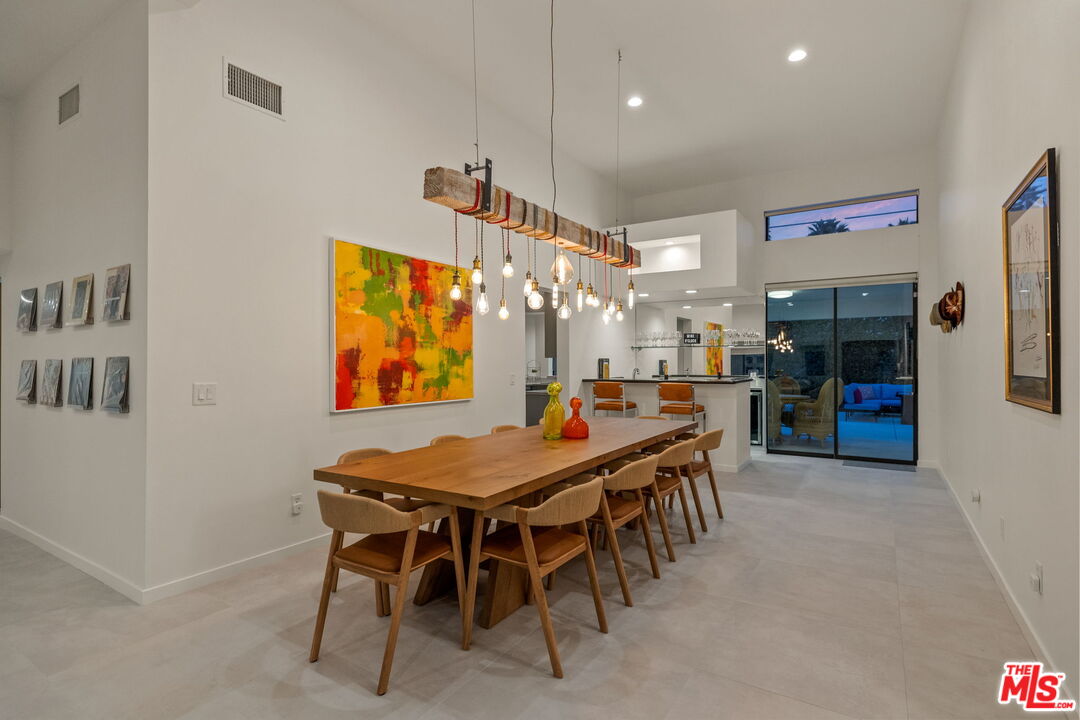 1414 Sagebrush Road Palm Springs, CA 92264 - Photo 14 of 48 a table and chairs in a room