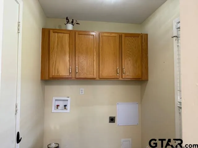 a view of cabinets and wooden floor