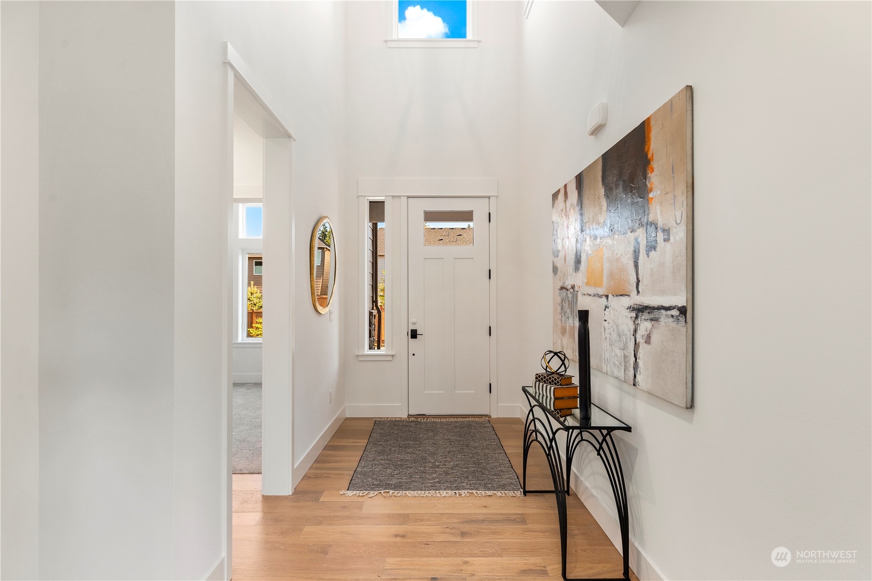 7 179th Place Southwest Bothell, WA 98012 - Photo 17 of 33 a view of a hallway with wooden floor and closet