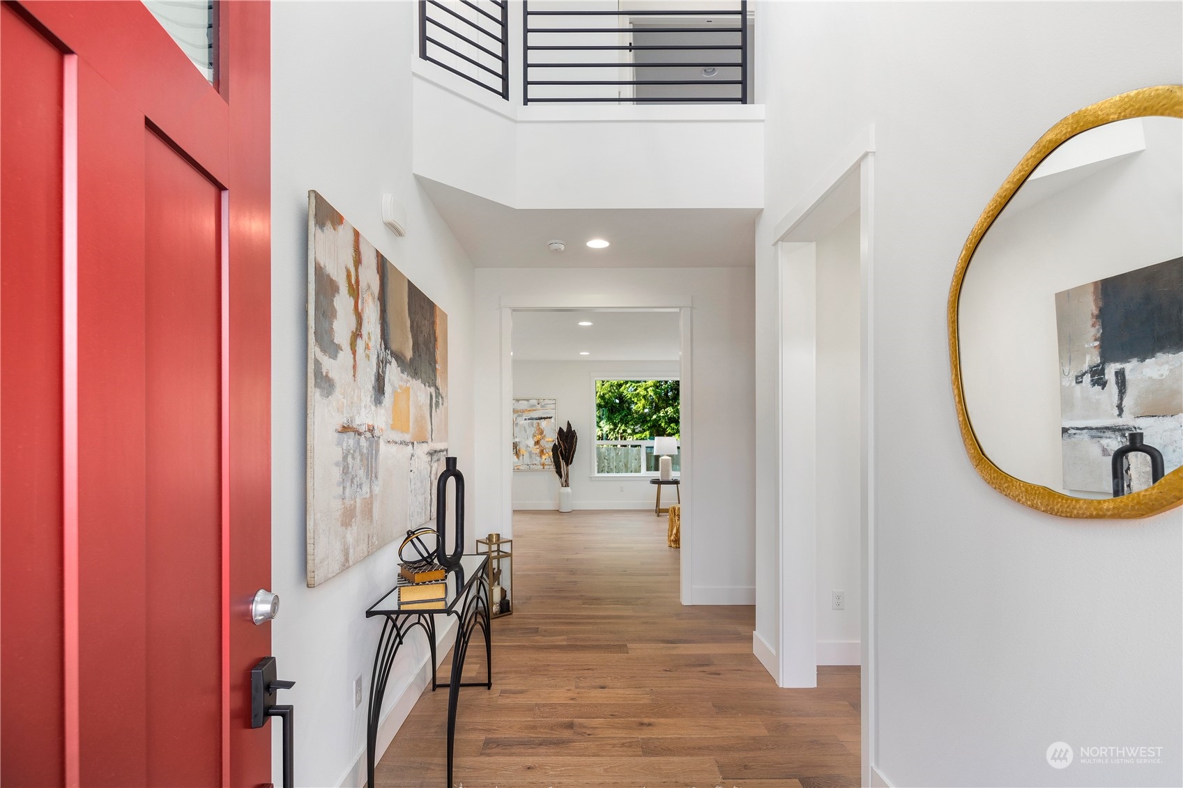 7 179th Place Southwest Bothell, WA 98012 - Photo 18 of 33 a view of a hallway with wooden floor and furniture