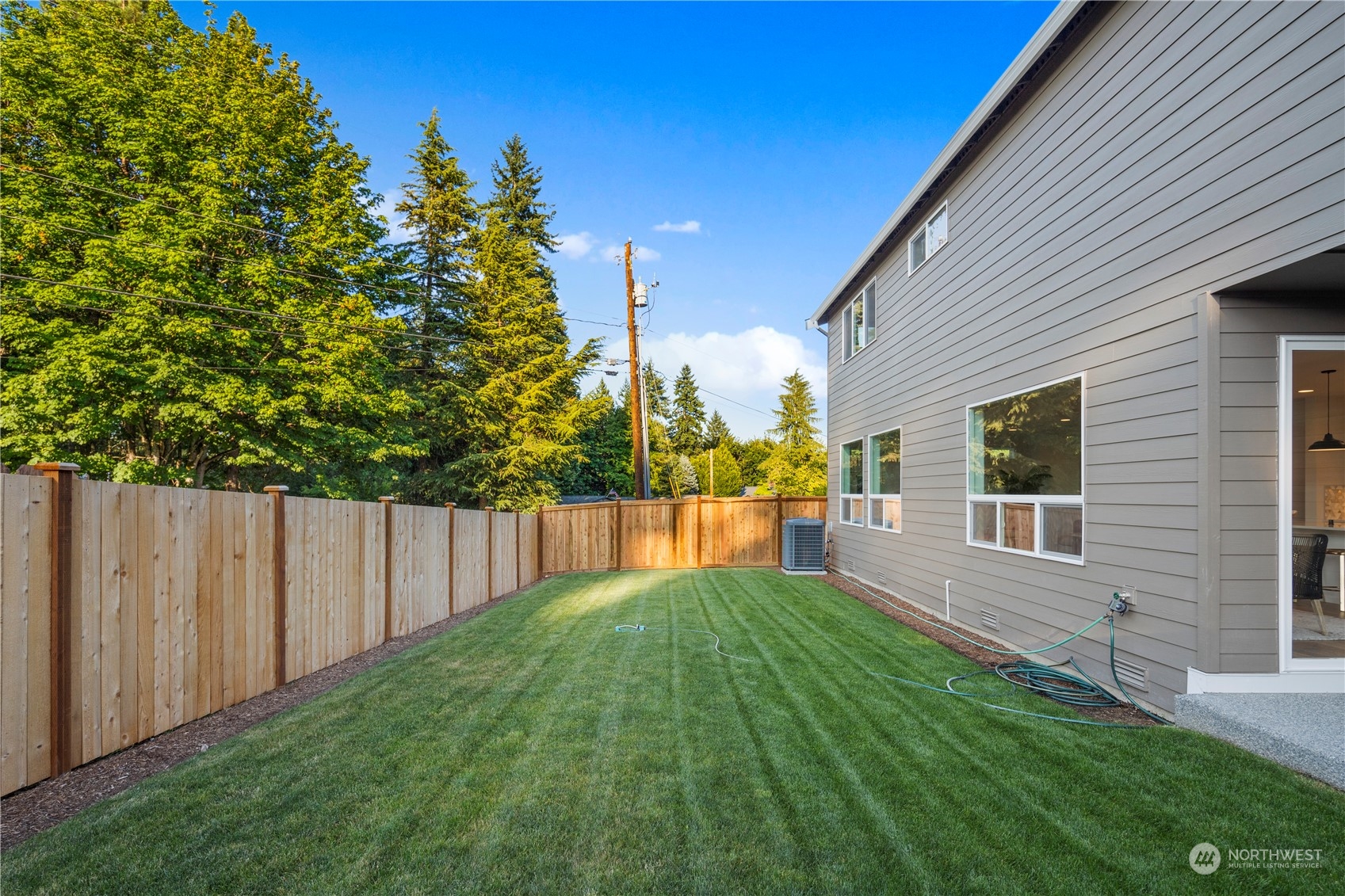 7 179th Place Southwest Bothell, WA 98012 - Photo 33 of 33 a view of house with backyard and a tree