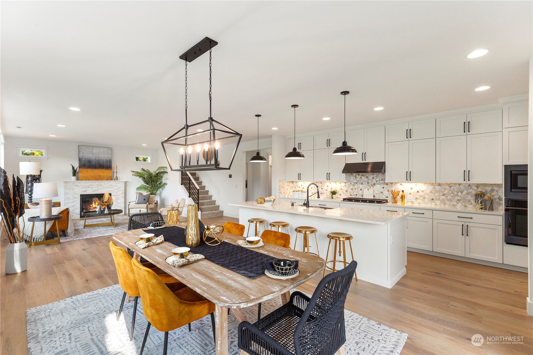 7 179th Place Southwest Bothell, WA 98012 - Photo 5 of 33 a kitchen with stainless steel appliances granite countertop a kitchen island a stove a table and chairs