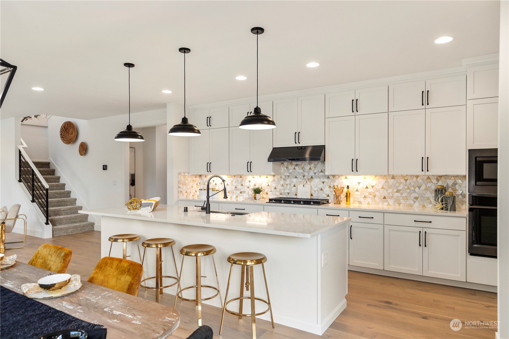 7 179th Place Southwest Bothell, WA 98012 - Photo 10 of 33 a kitchen with kitchen island granite countertop a sink a counter top space and cabinets