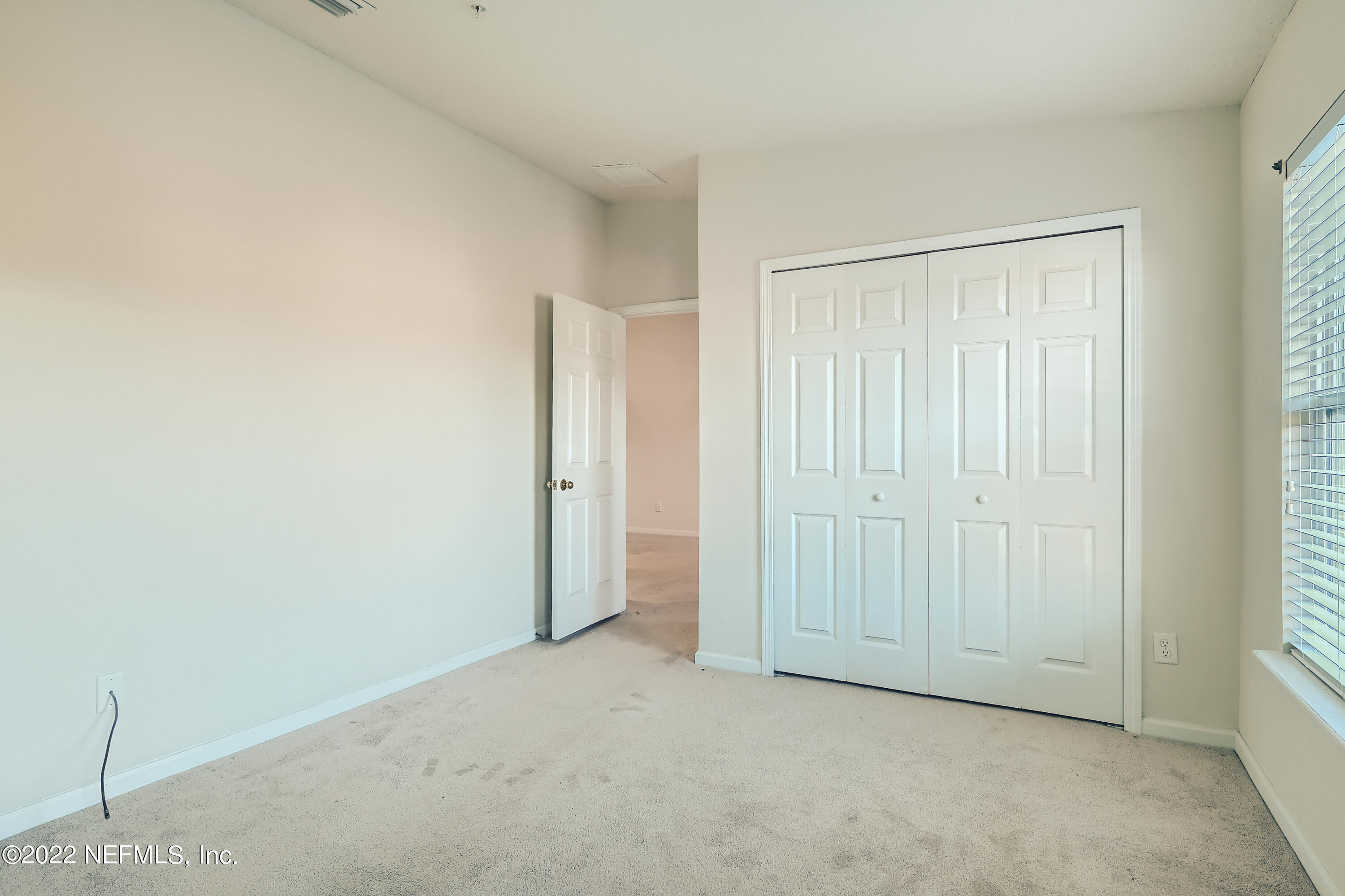 511 Golden Lake Loop St. Augustine, FL 32084 - Photo 16 of 32 an empty room with closet area