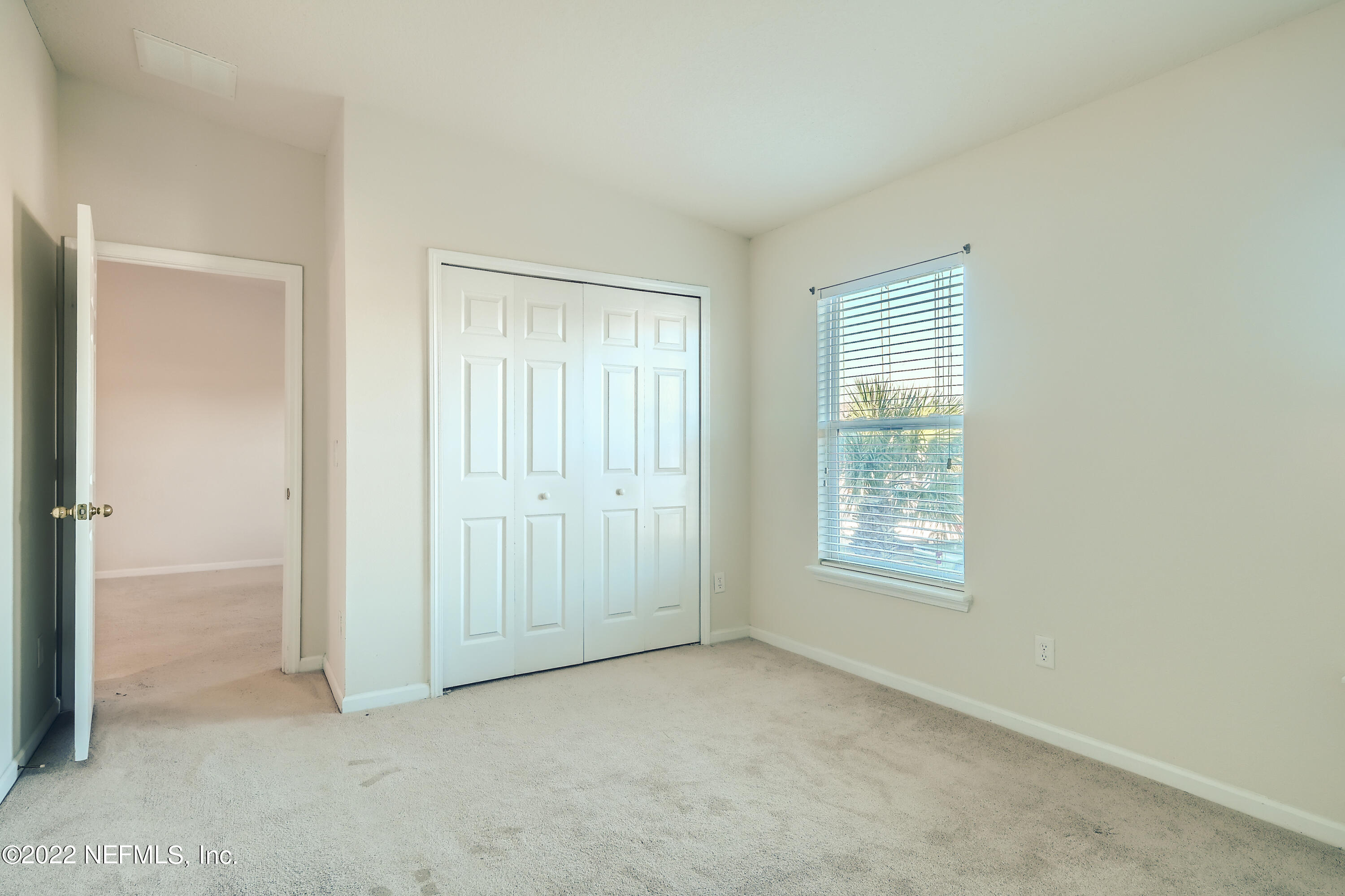 511 Golden Lake Loop St. Augustine, FL 32084 - Photo 17 of 32 an empty room with windows