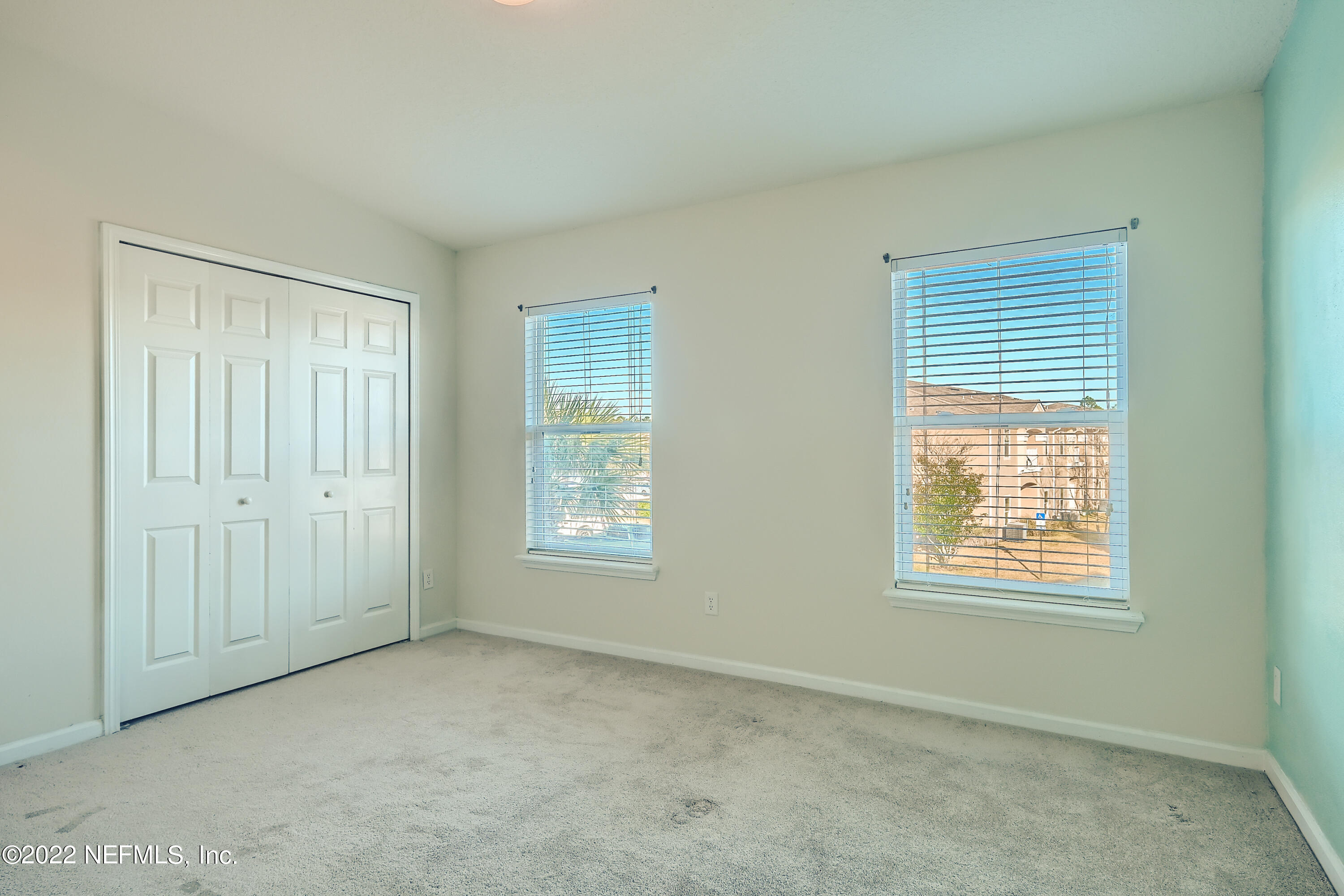 511 Golden Lake Loop St. Augustine, FL 32084 - Photo 18 of 32 an empty room with windows