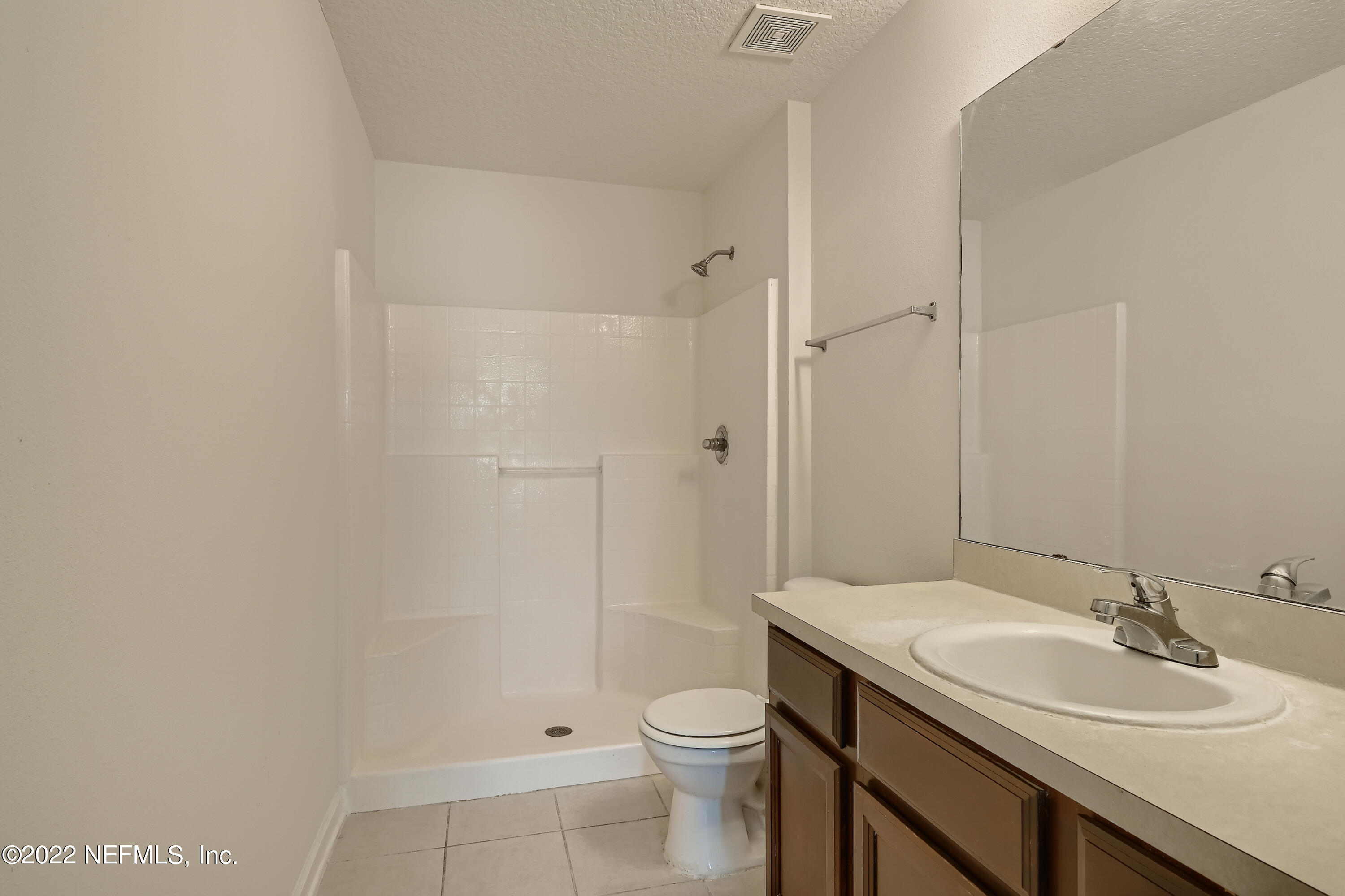 511 Golden Lake Loop St. Augustine, FL 32084 - Photo 19 of 32 a bathroom with a sink a toilet and shower