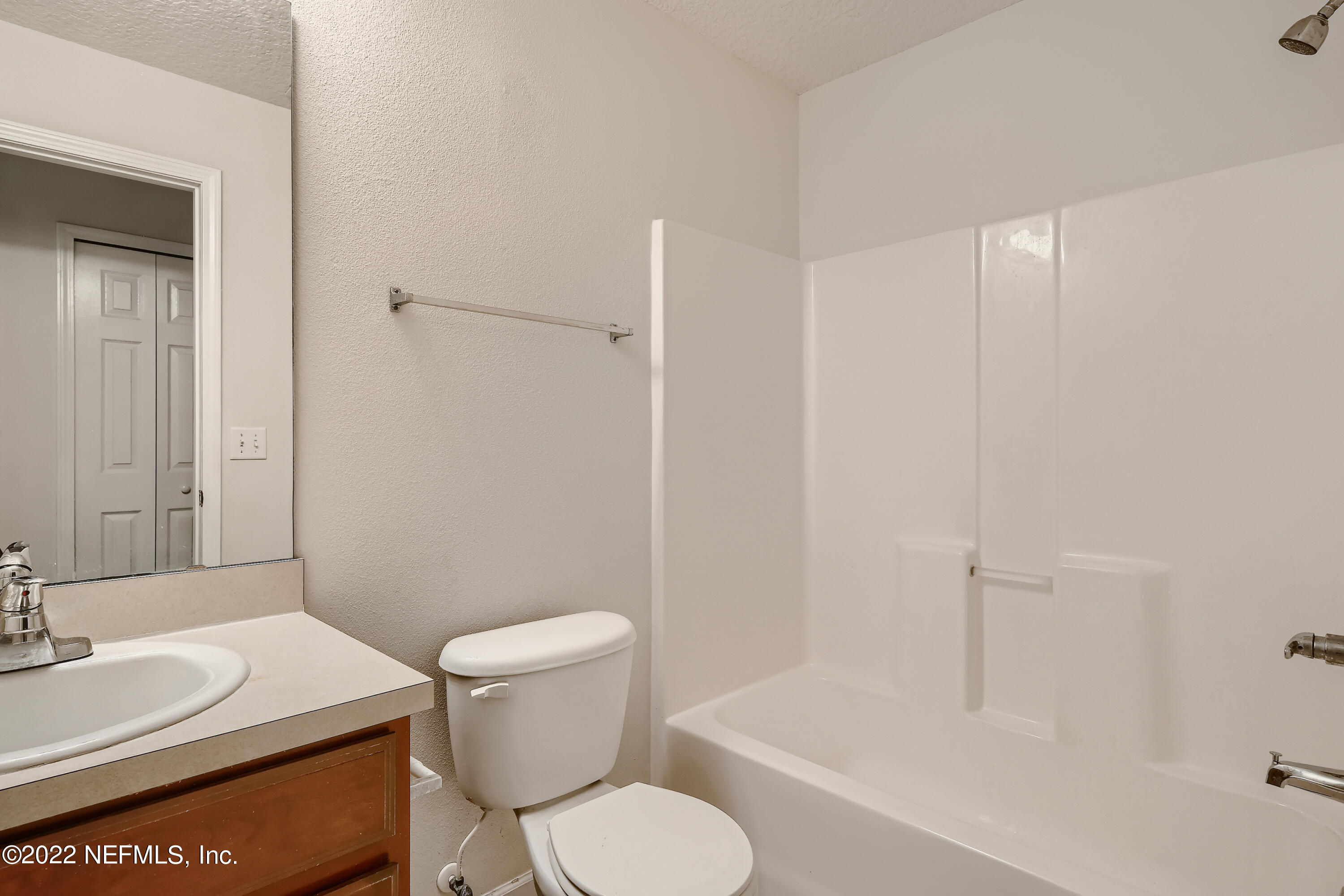 511 Golden Lake Loop St. Augustine, FL 32084 - Photo 23 of 32 a white toilet sitting next to a bathroom sink