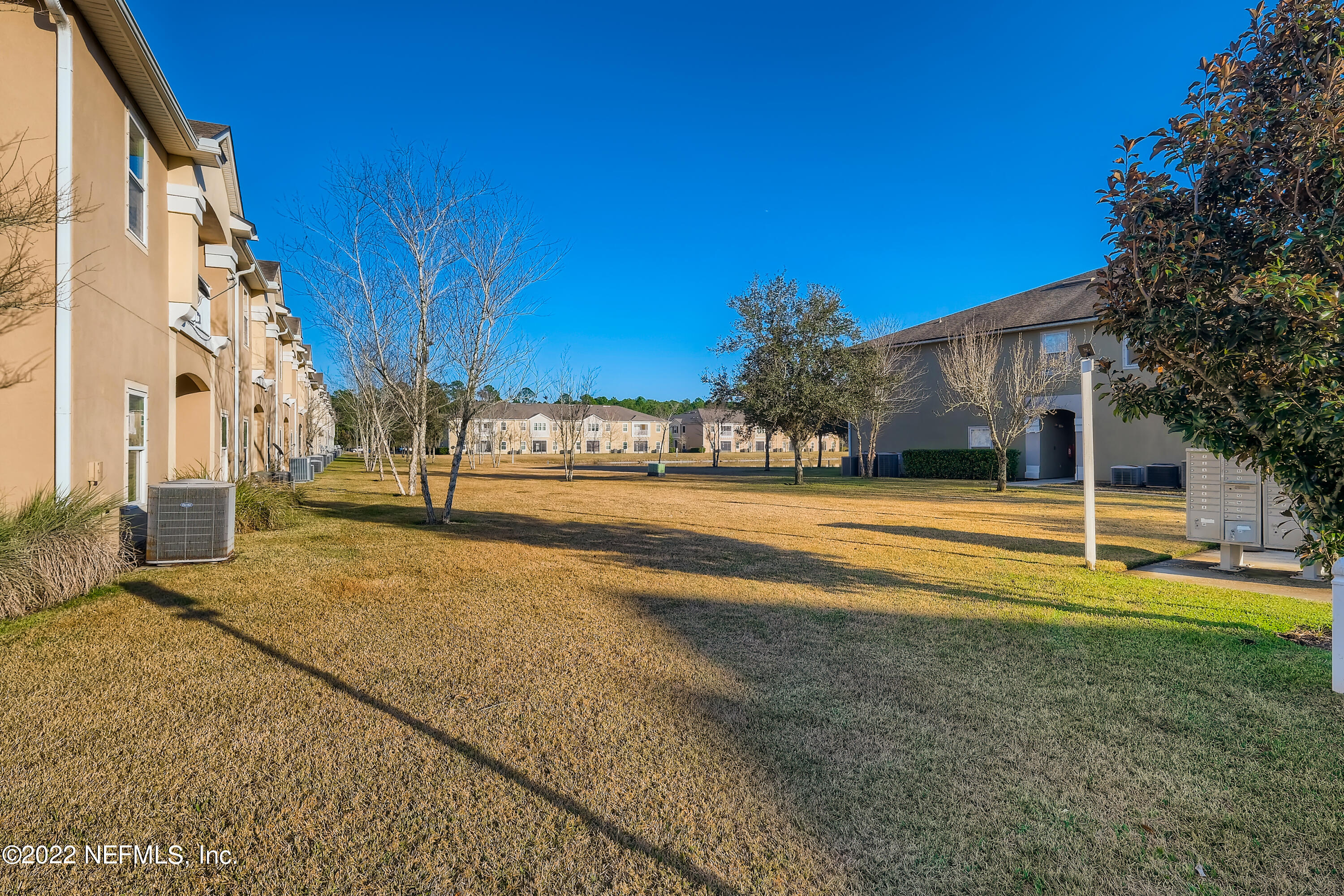 511 Golden Lake Loop St. Augustine, FL 32084 - Photo 29 of 32 a view of road with large trees