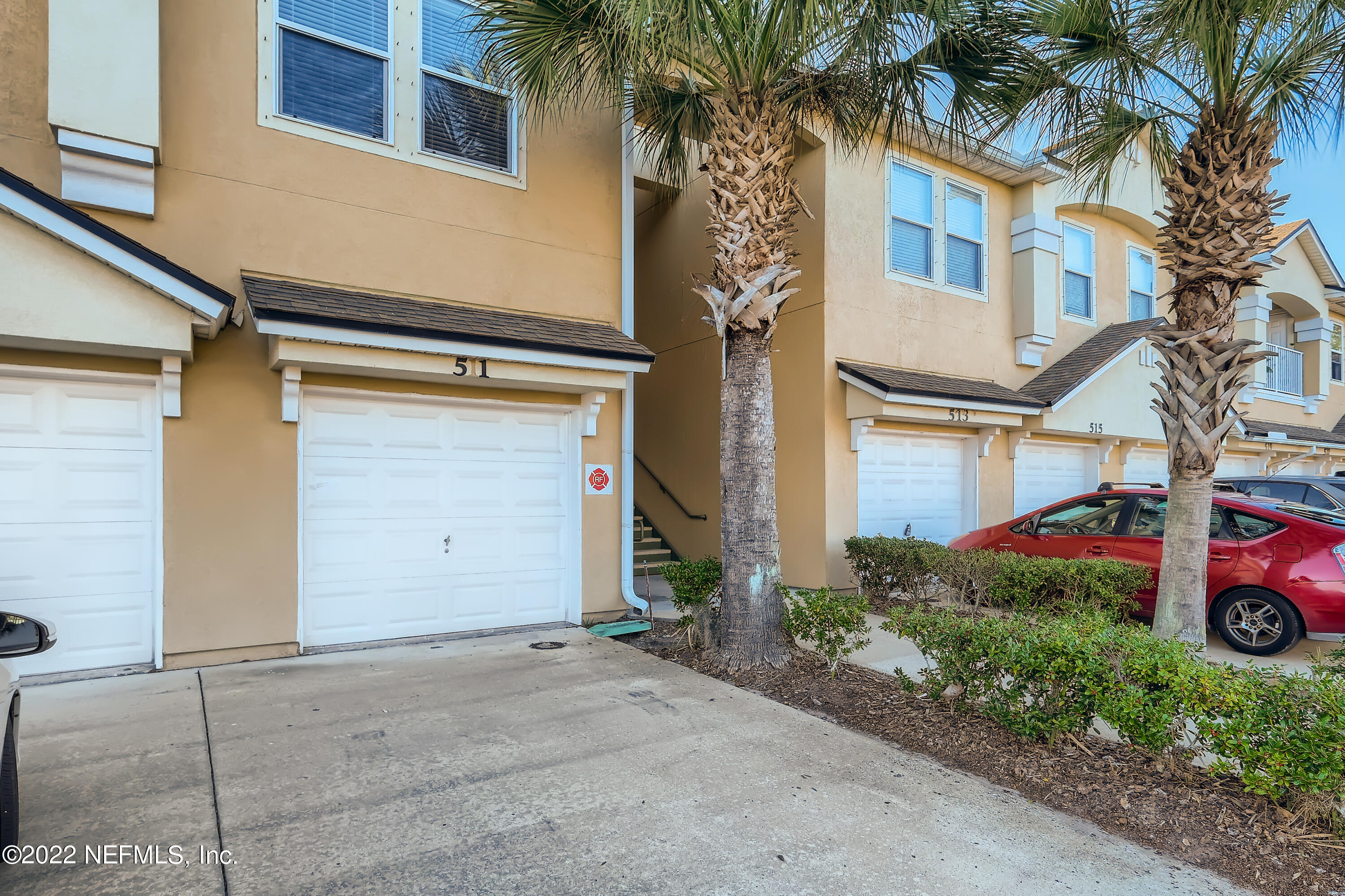 511 Golden Lake Loop St. Augustine, FL 32084 - Photo 3 of 32 a front view of a house with garage and plants