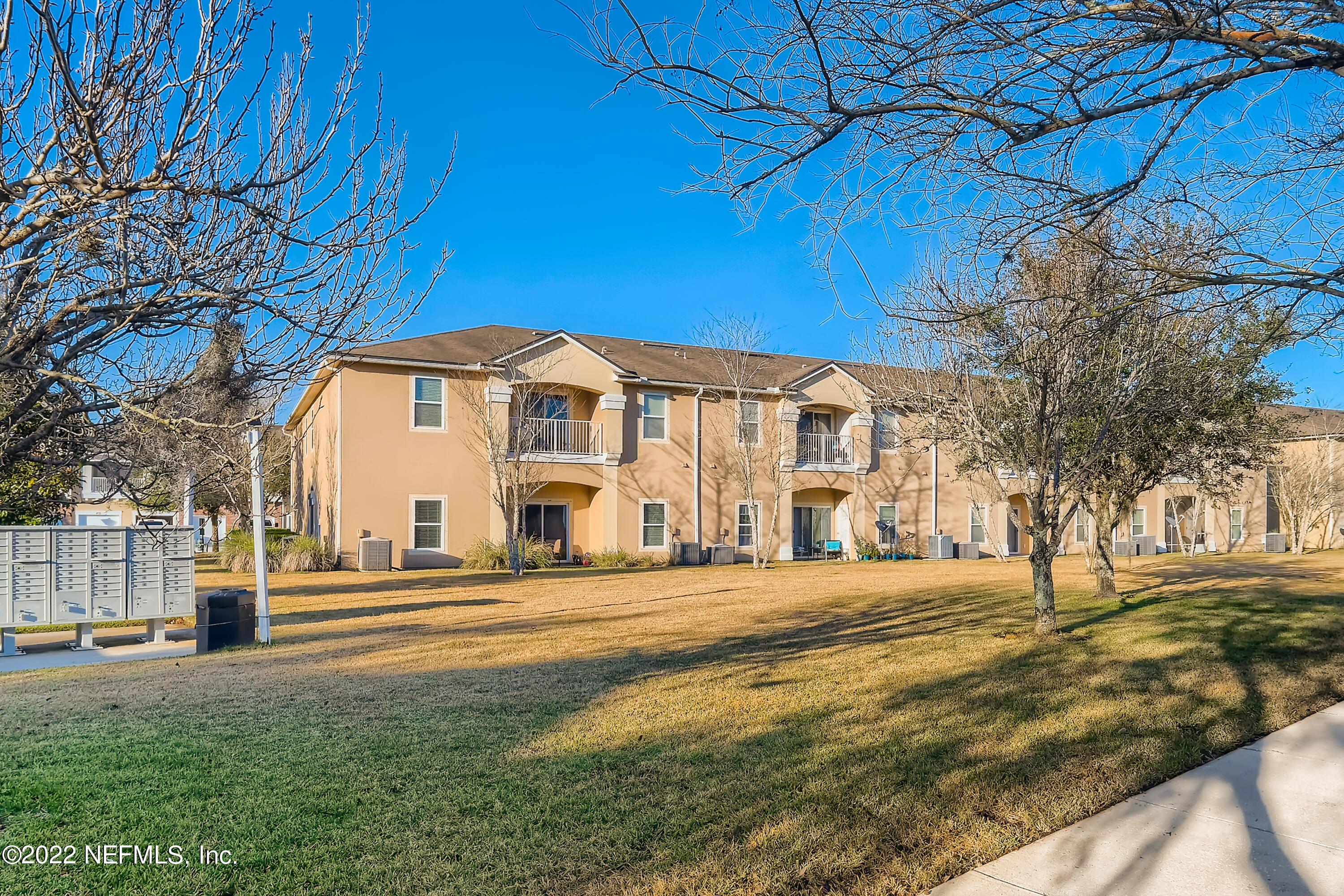 511 Golden Lake Loop St. Augustine, FL 32084 - Photo 31 of 32 a front view of a building with a garden