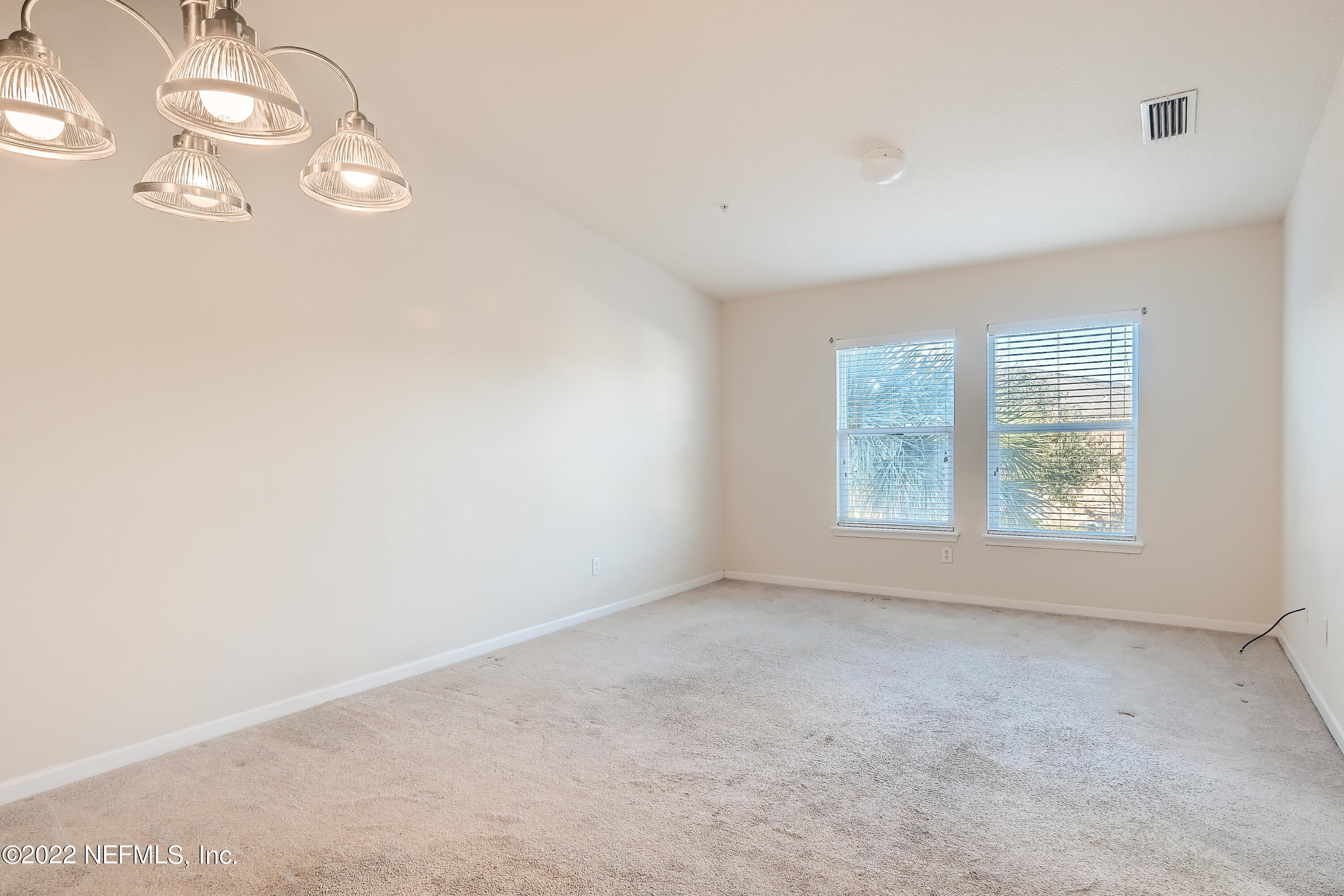 511 Golden Lake Loop St. Augustine, FL 32084 - Photo 6 of 32 an empty room with windows