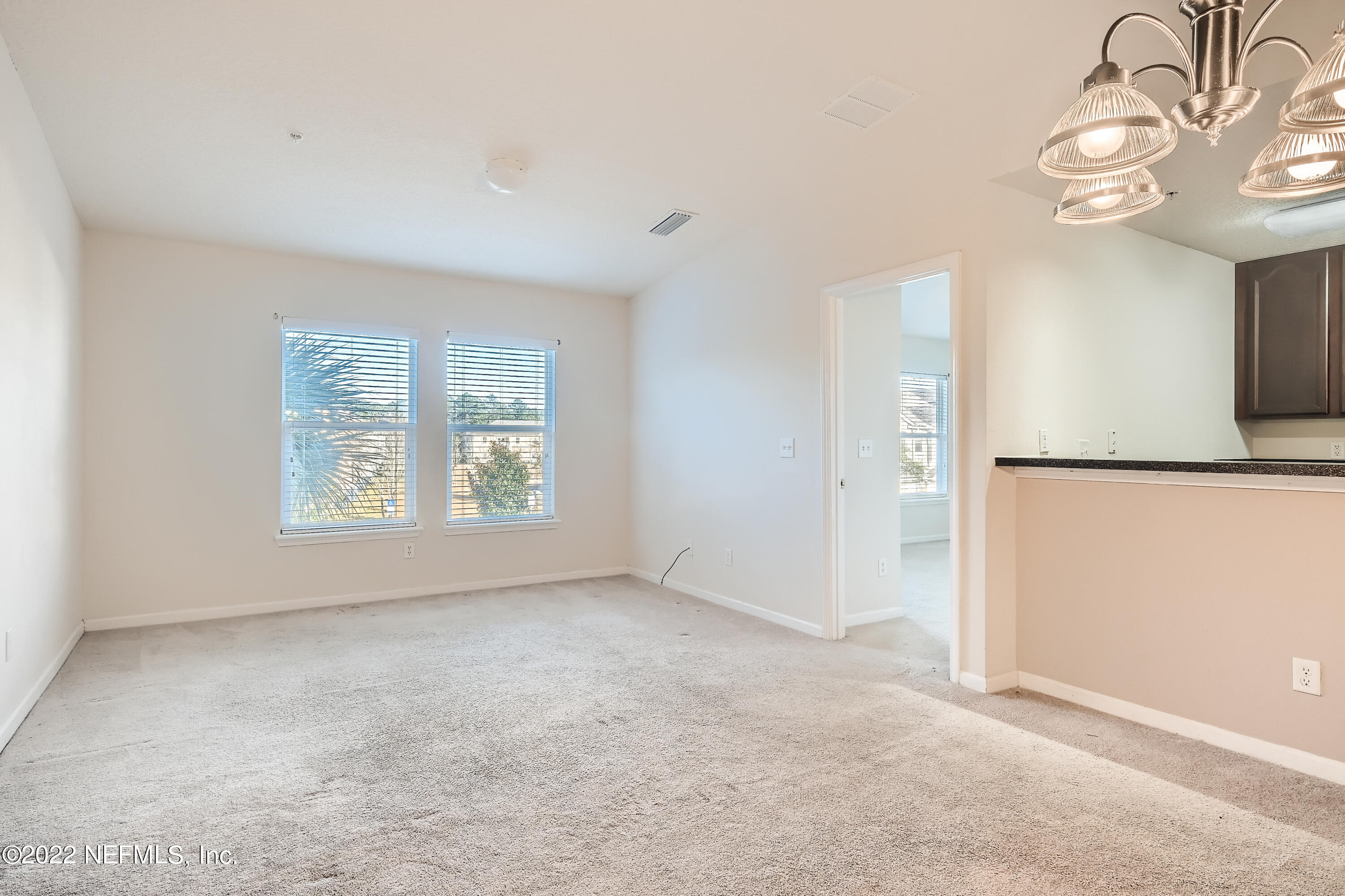 511 Golden Lake Loop St. Augustine, FL 32084 - Photo 7 of 32 an empty room with windows and entrance