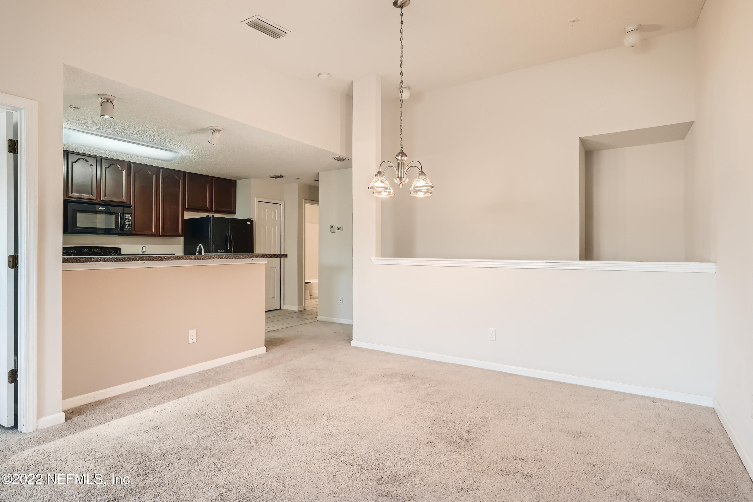 511 Golden Lake Loop St. Augustine, FL 32084 - Photo 10 of 32 a view of a kitchen with a sink and microwave