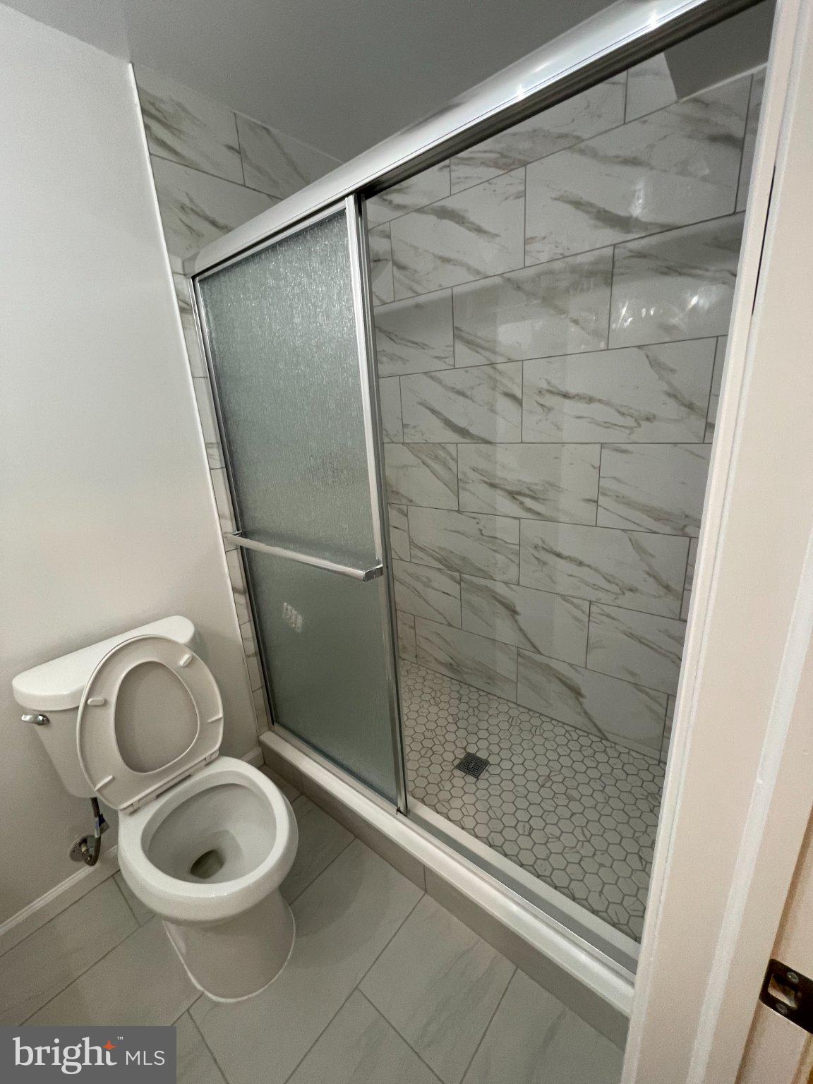 2016 Gatewood Place Silver Spring, MD 20903 - Photo 22 of 24 a bathroom with a toilet and a shower