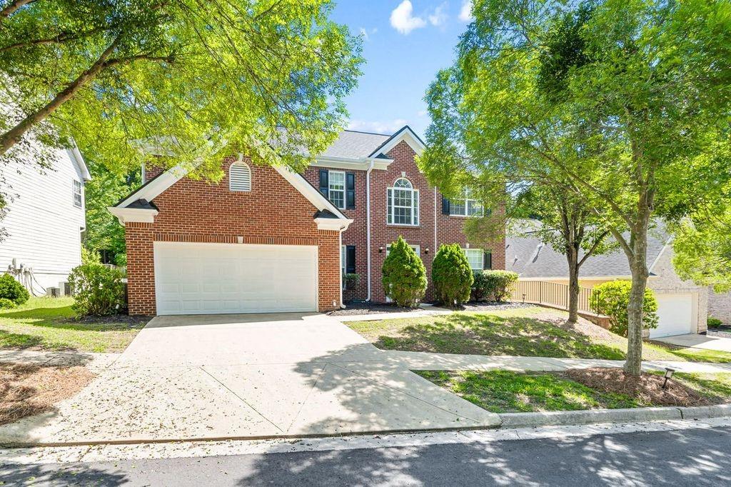 473 Greyhawk Way Fairburn, GA 30213 - Photo 32 of 34 a front view of a house with a yard and garage