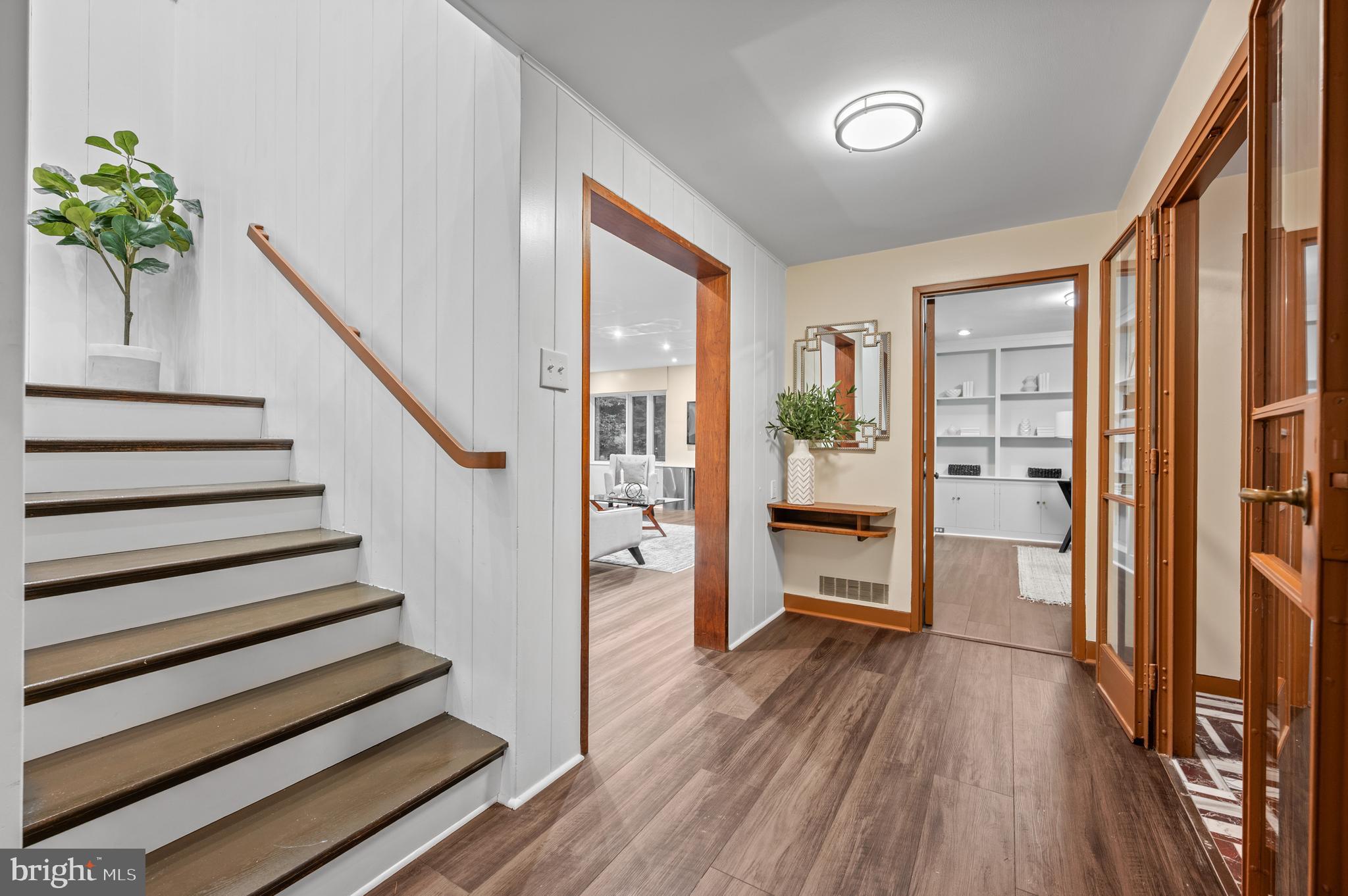 829 Black Rock Road Gladwyne, PA 19035 - Photo 8 of 20 a view of a hallway with wooden floor and entryway