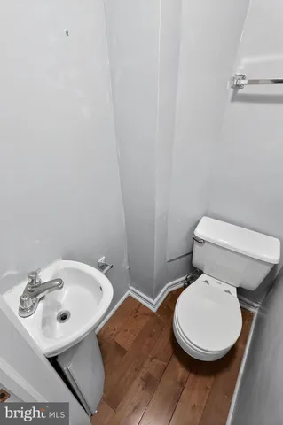a bathroom with a toilet and a sink