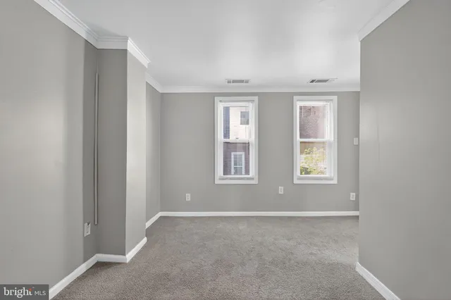 an empty room with windows