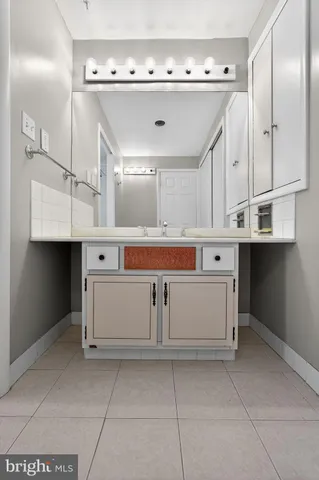 a view of cabinets a sink and dishwasher with window
