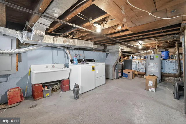 a utility room with dryer and bicycles