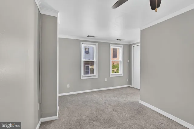 an empty room with windows