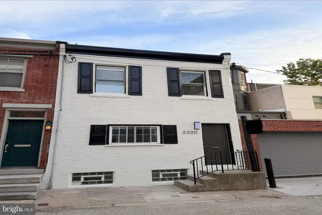 a front view of a house with garage